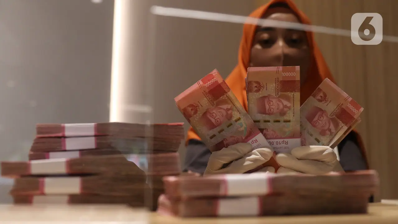 Rupiah Kembali Tembus 18.000 per Dolar AS, Konflik AS-Iran Jadi Pemicu image 1