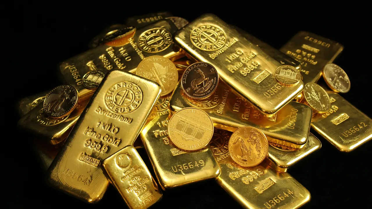 Harga Emas Dunia Merosot Dipicu Isu The Fed dan Perang Timur Tengah image 0